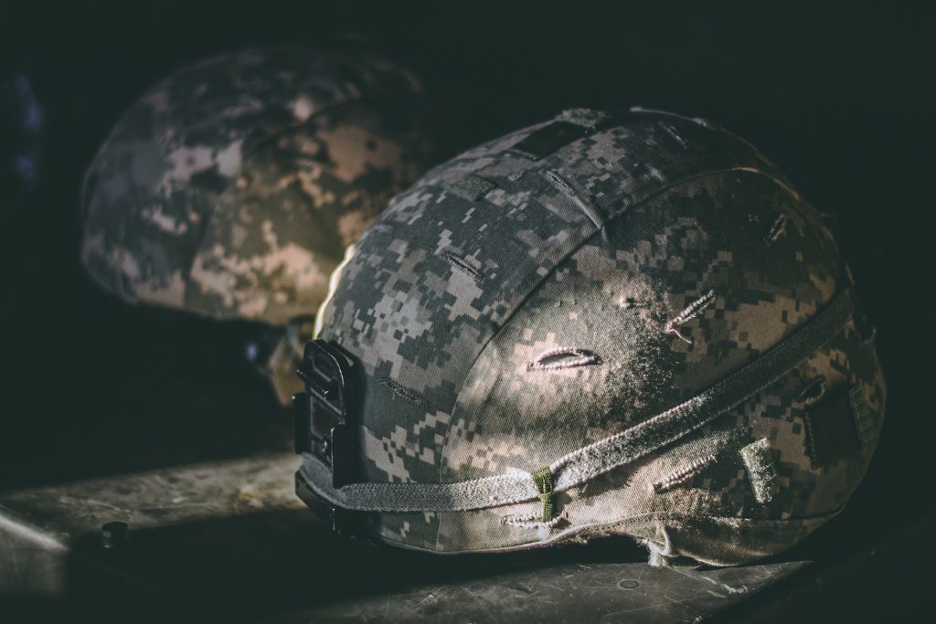 decorative image: military helmets.