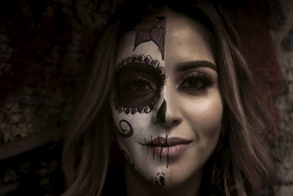 decorative image: woman with face paint for the day of the dead