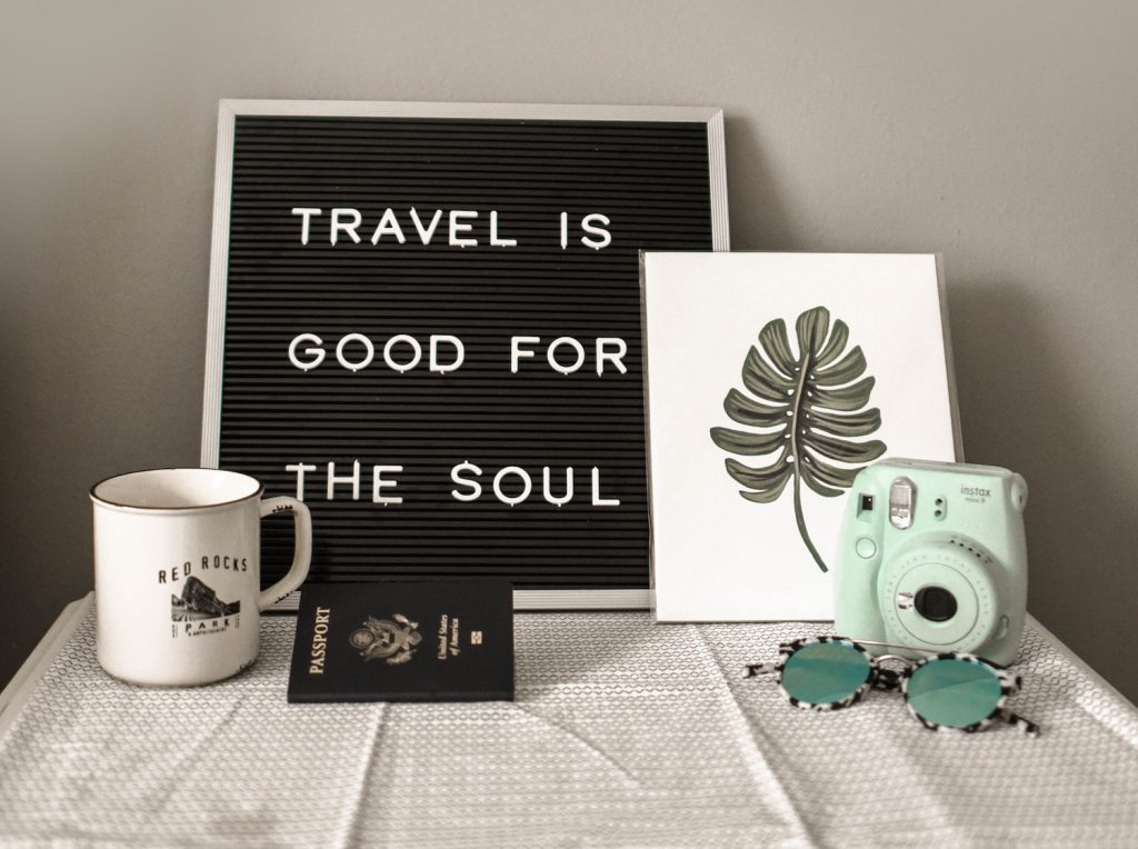 decorative image: teal Instax Mini 8 instant camera near decor