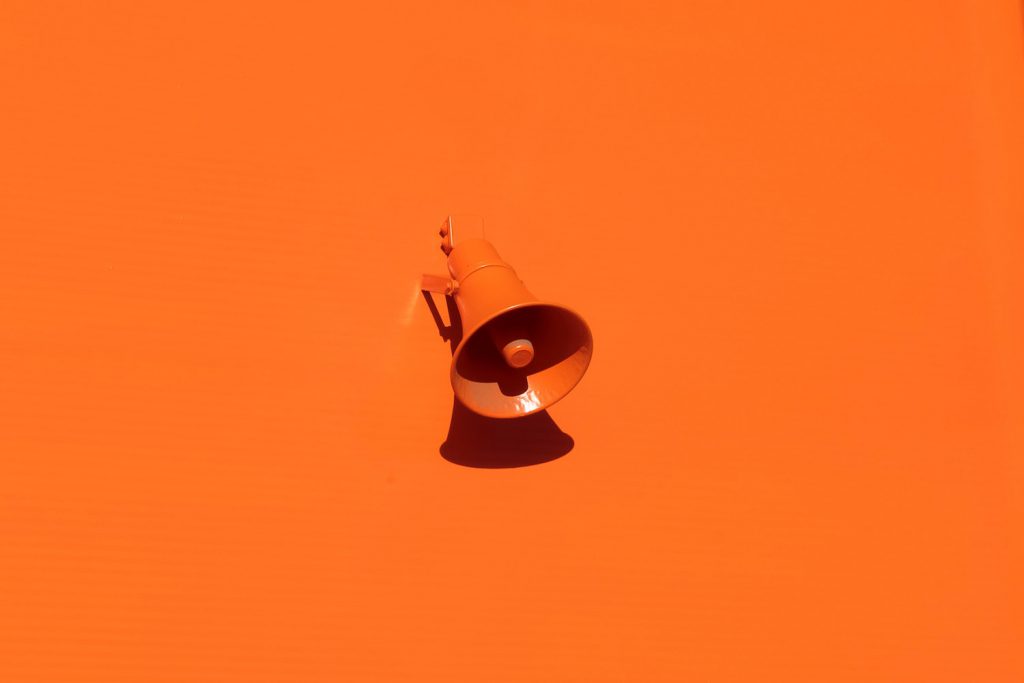 decorative image: orange megaphone