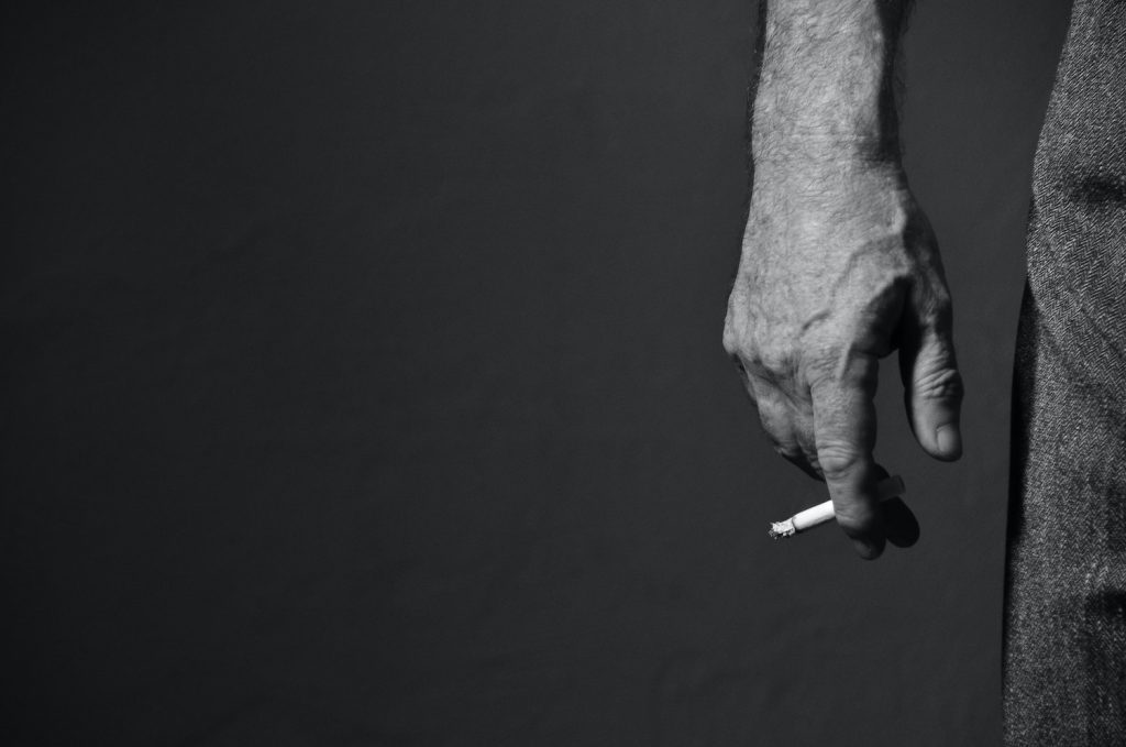 arm holding a cigarette