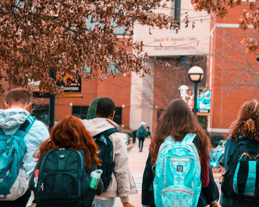 Kids walking into a school building