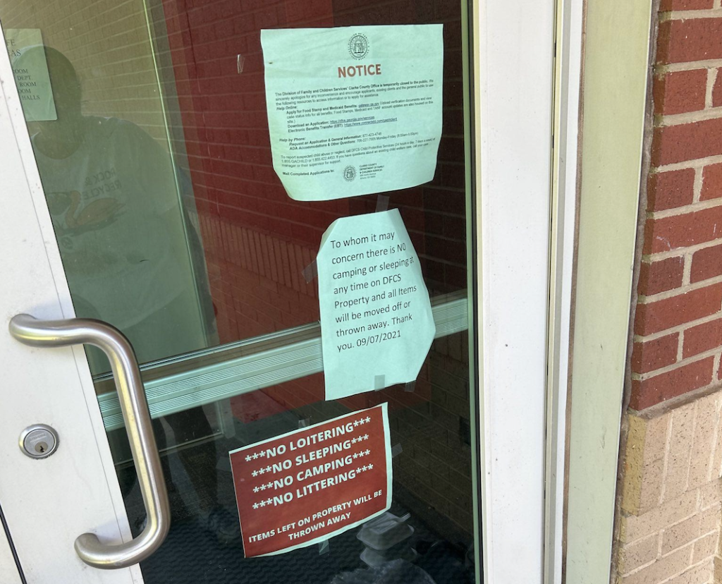 Door highlighting Athens Clarke County policies related to homelessness.